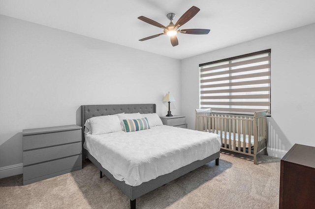 bedroom with light colored carpet and ceiling fan