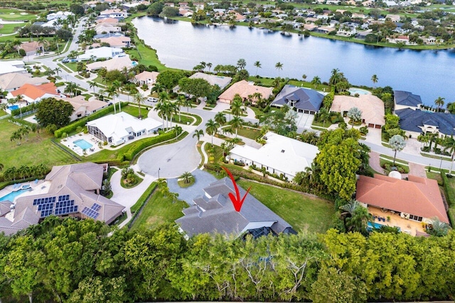 birds eye view of property featuring a water view