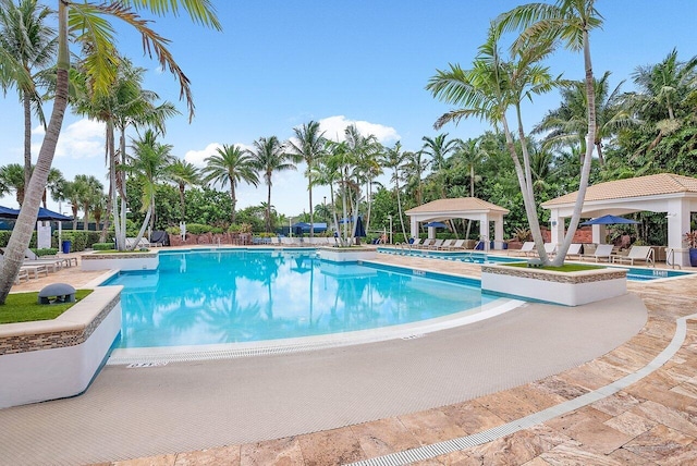 view of swimming pool with a gazebo and a patio