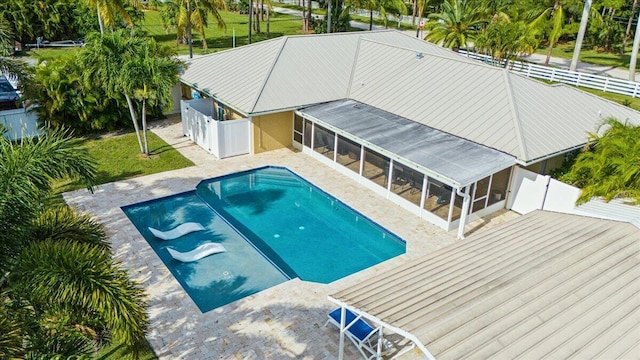 view of swimming pool with a patio area