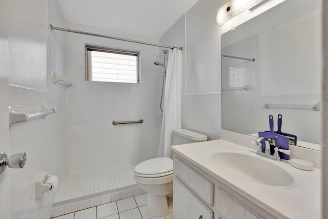 bathroom with walk in shower, tile patterned flooring, toilet, vanity, and tile walls