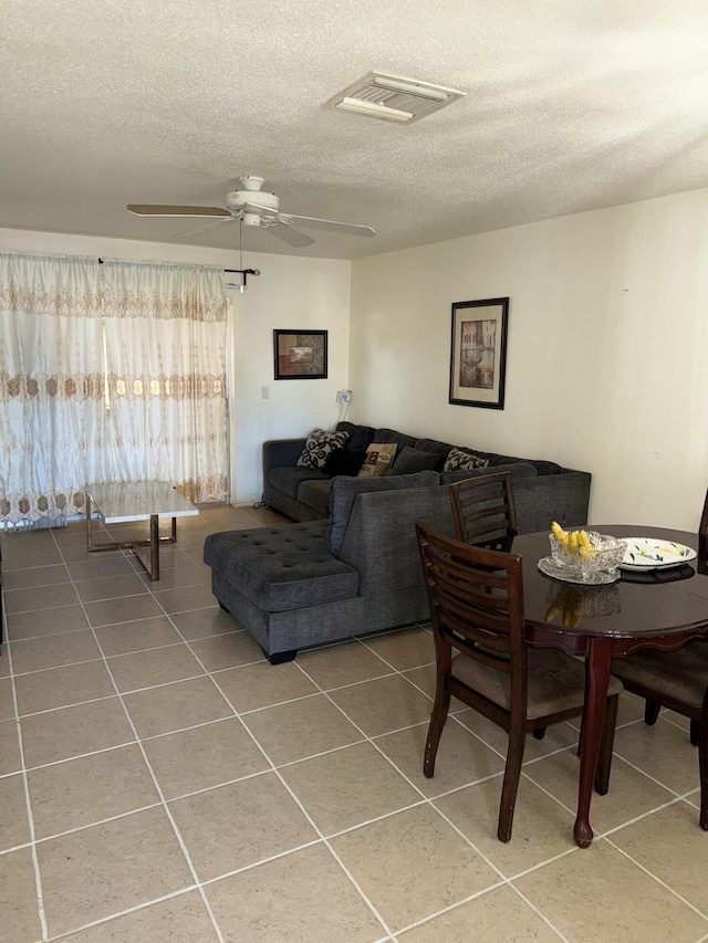 tiled living room with a textured ceiling