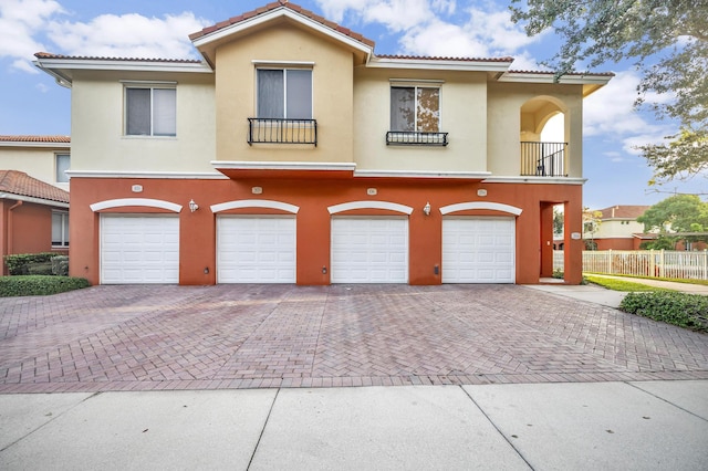 mediterranean / spanish-style house featuring a garage