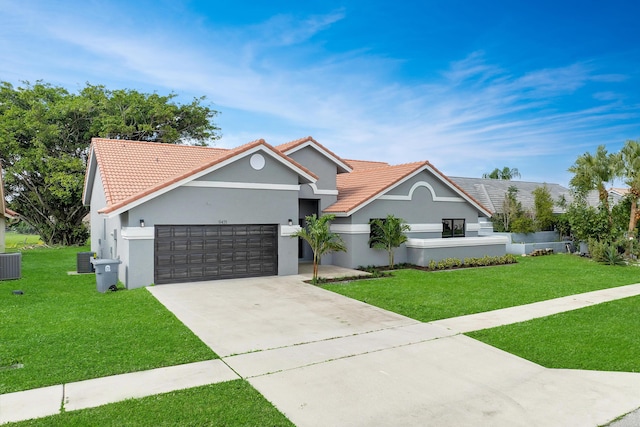 view of front facade with cooling unit, a front yard, and a garage