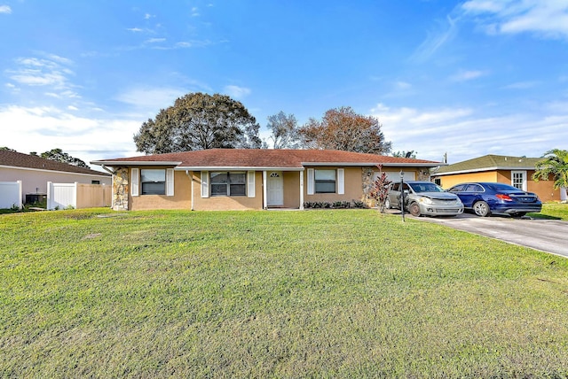 ranch-style house with a front lawn