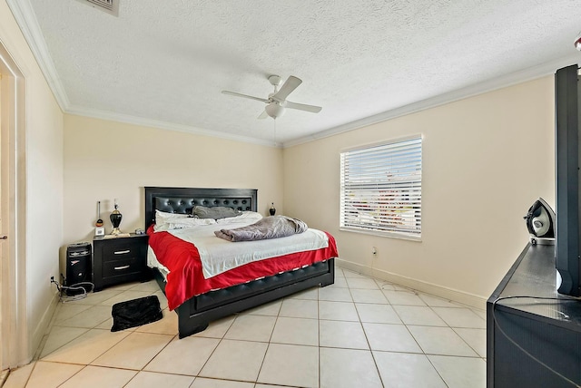 tiled bedroom with a textured ceiling, ceiling fan, and crown molding