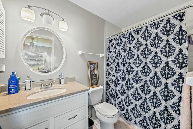 bathroom with vanity, tile patterned floors, toilet, a textured ceiling, and walk in shower