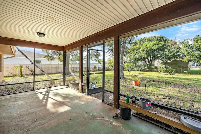 unfurnished sunroom featuring a healthy amount of sunlight