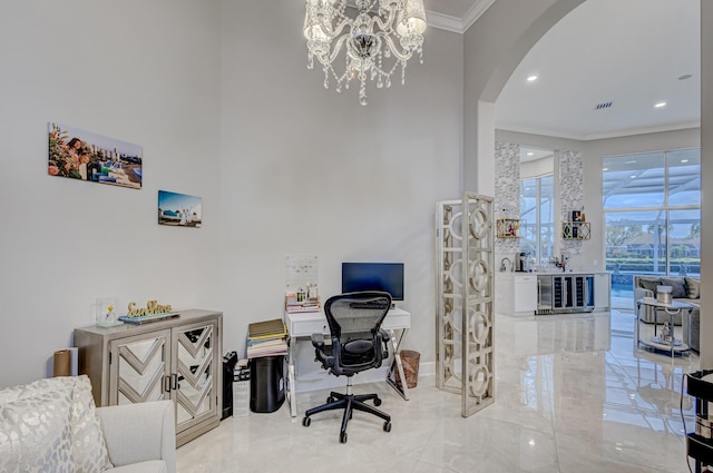 office space with crown molding and an inviting chandelier