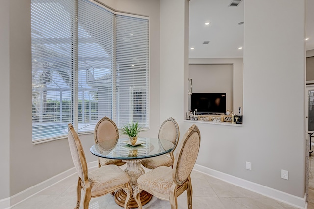 dining area featuring light tile patterned floors