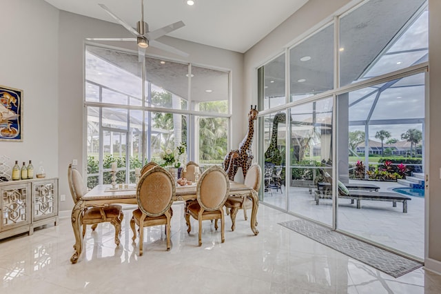 sunroom with ceiling fan and a healthy amount of sunlight