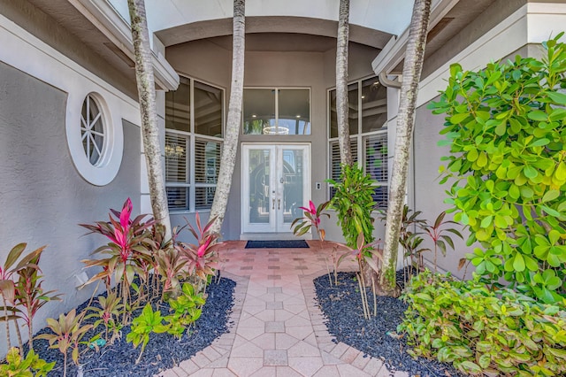 view of exterior entry featuring french doors