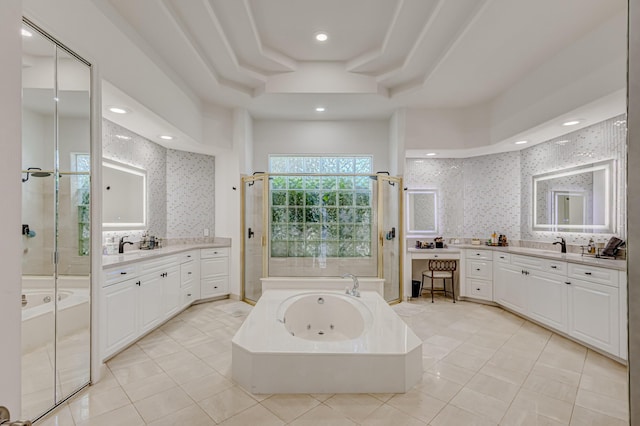 bathroom featuring separate shower and tub, vanity, tile patterned floors, and a raised ceiling