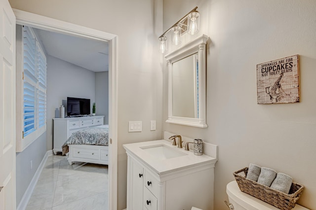 bathroom featuring tile patterned floors, toilet, and vanity