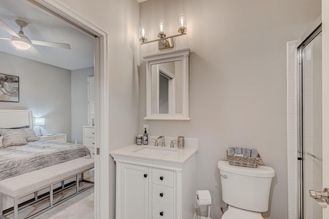 bathroom featuring ceiling fan, vanity, toilet, and walk in shower