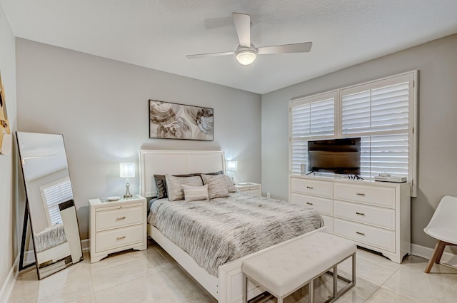 tiled bedroom featuring ceiling fan