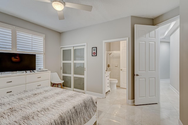 bedroom featuring ceiling fan and connected bathroom