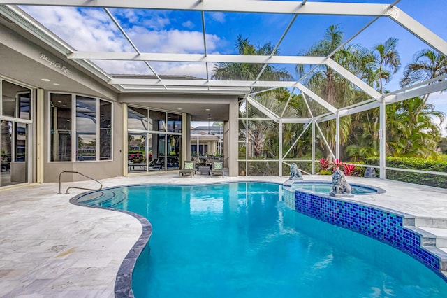 view of pool featuring an in ground hot tub, a lanai, and a patio area