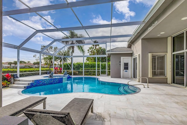 view of swimming pool featuring a lanai, a patio, and an in ground hot tub