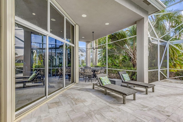 view of patio / terrace featuring a lanai