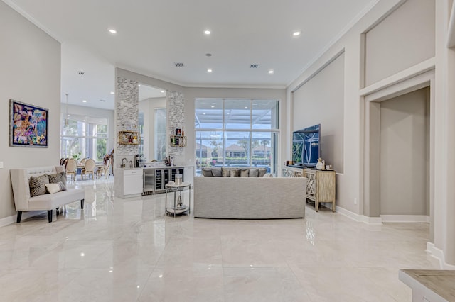 living room with beverage cooler and crown molding