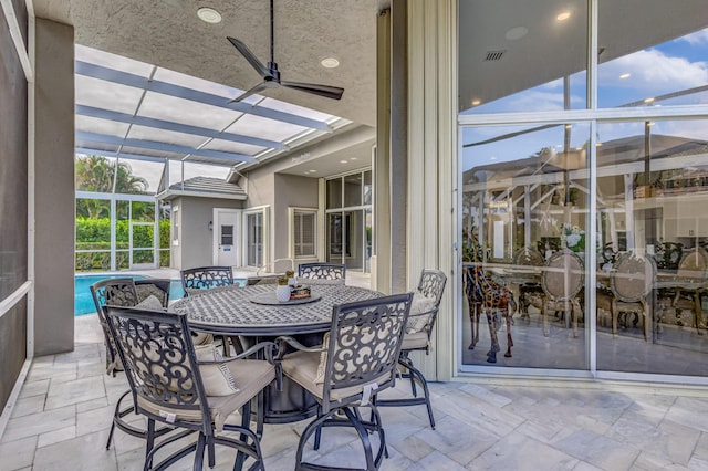 sunroom / solarium with ceiling fan