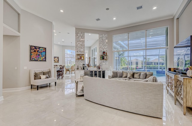 living room with a wealth of natural light and crown molding