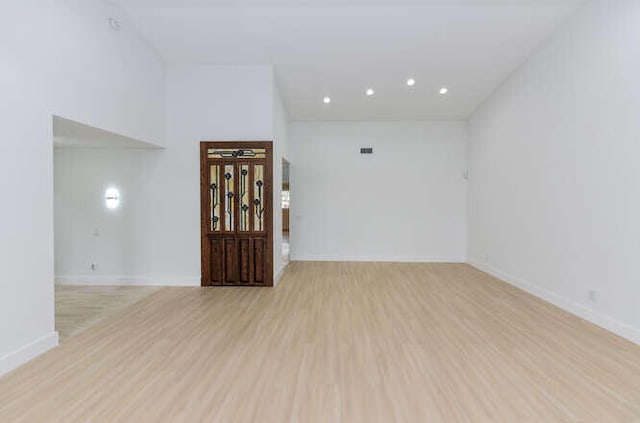 spare room featuring light hardwood / wood-style floors