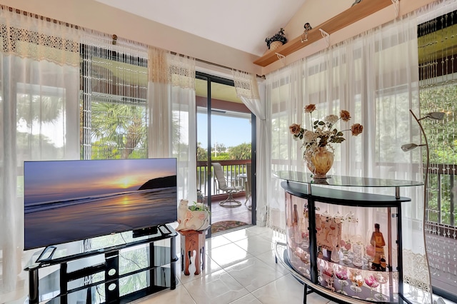 sunroom featuring vaulted ceiling