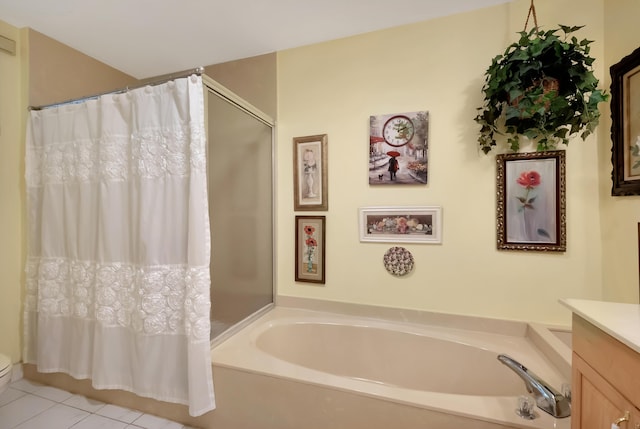 full bathroom with tile patterned floors, plus walk in shower, vanity, and toilet