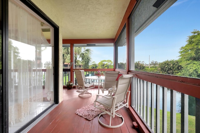 balcony featuring a water view