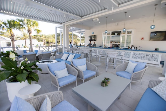 view of patio / terrace with an outdoor hangout area and a bar