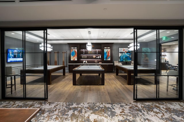 playroom with hardwood / wood-style floors and pool table