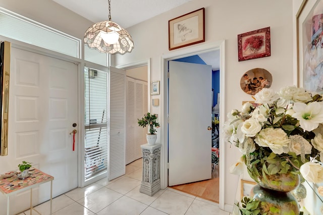 entryway featuring light tile patterned floors