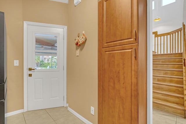 entryway featuring light tile patterned floors