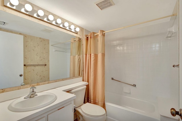 full bathroom featuring vanity, toilet, and shower / bath combo with shower curtain