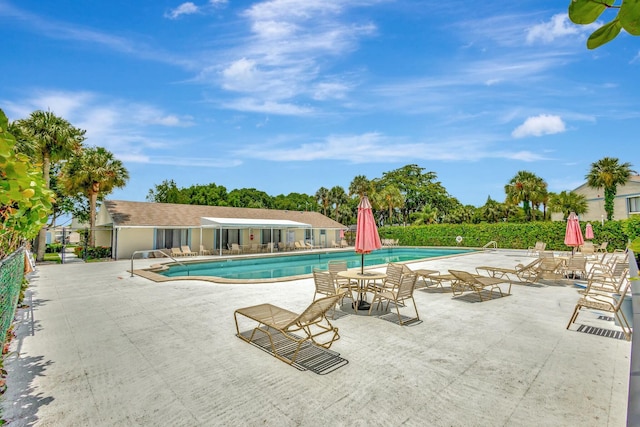 view of swimming pool with a patio