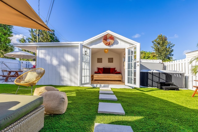 exterior space with a lawn and an outdoor structure