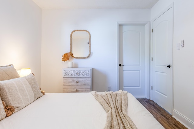 bedroom featuring dark hardwood / wood-style floors