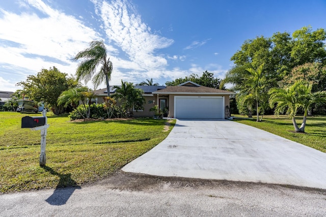 ranch-style house with a front yard, solar panels, and a garage