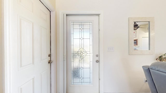 entrance foyer featuring ceiling fan