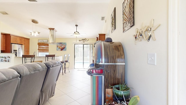 living room featuring ceiling fan and light tile patterned flooring