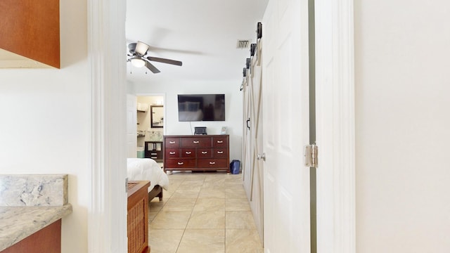 interior space featuring ceiling fan