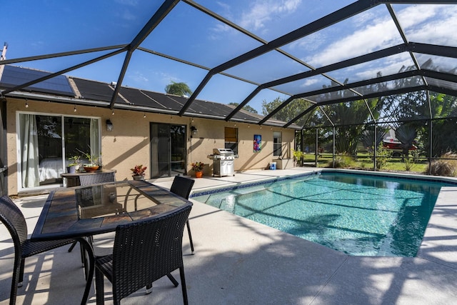 view of pool featuring a lanai, a patio area, and area for grilling