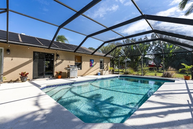 view of pool featuring a patio area, a lanai, and grilling area