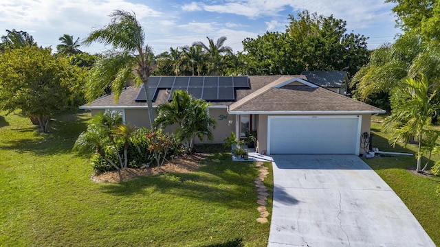 view of front facade featuring solar panels, a front lawn, and a garage