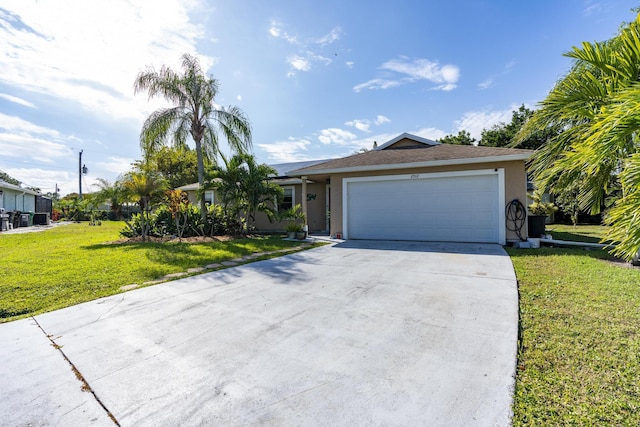 ranch-style house featuring a garage and a front lawn