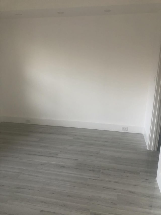 spare room featuring light hardwood / wood-style flooring