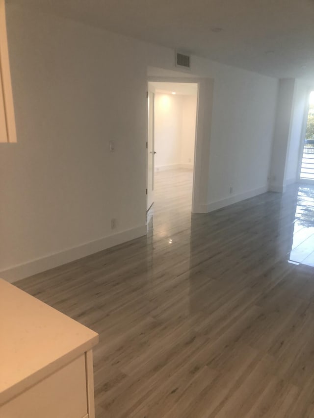 empty room featuring dark wood-type flooring