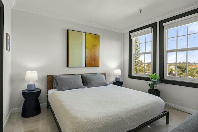 bedroom featuring multiple windows and ornamental molding